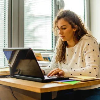 woman sitting in front of computer